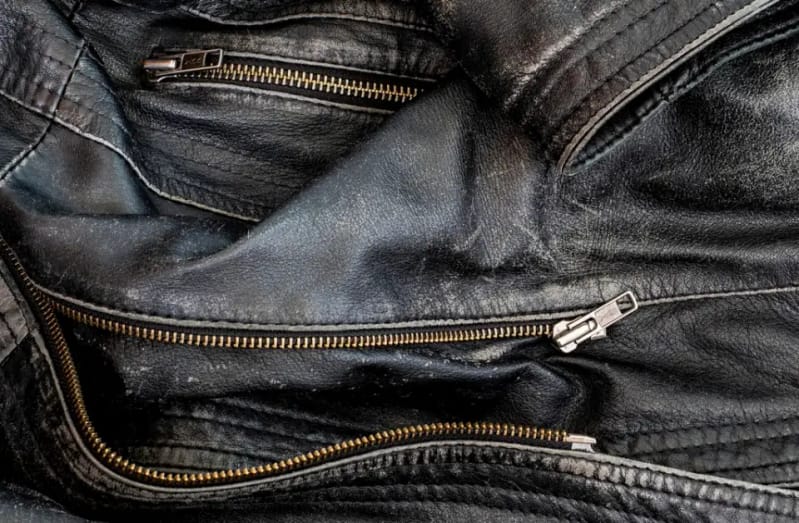 Zippers on a black leather jacket