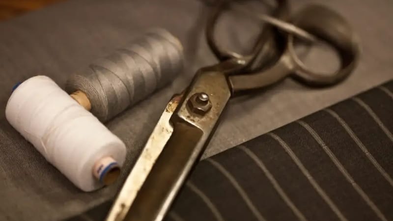 Scissors and spools on fabric