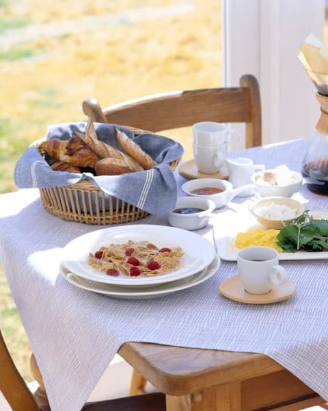 Sunny breakfast table with a coffee carafe