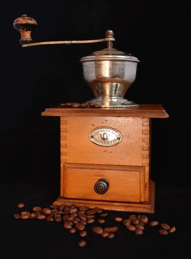 Hand grinder with brass crank