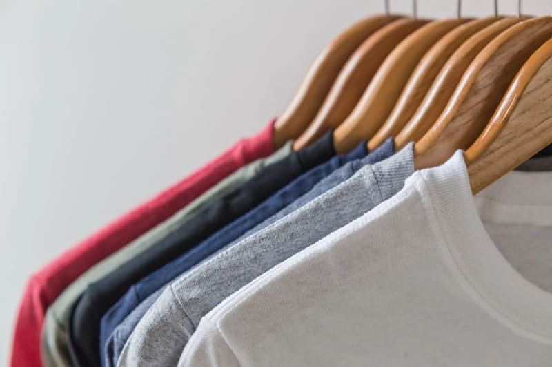T-shirts on wooden hangers