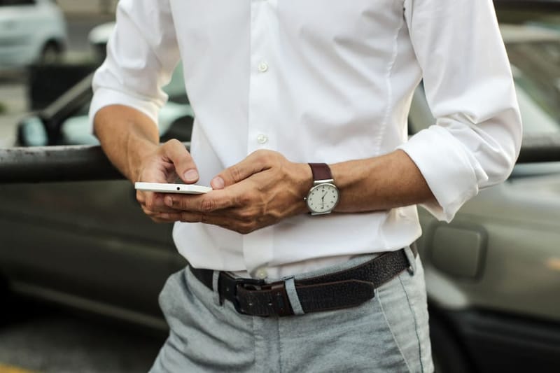 Watch on the wrist with a white shirt