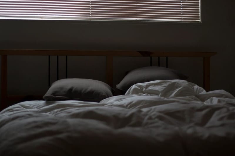 Bed with charcoal linen bedding