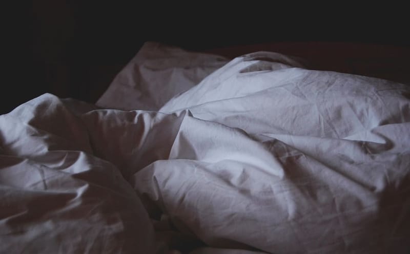 Rumpled grey linen bedding