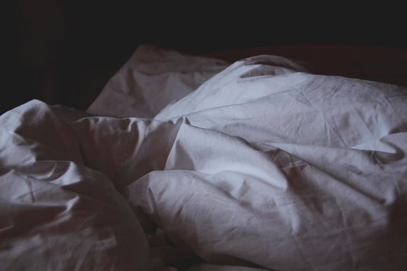 Rumpled grey linen bedding