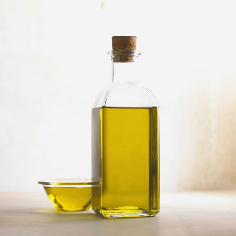 Olive oil in a glass bottle with cork