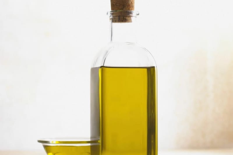 Olive oil in a glass bottle with cork