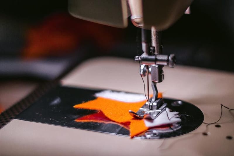 Sewing machine stitching fabric