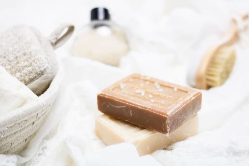 Soap bars on linen with a brush