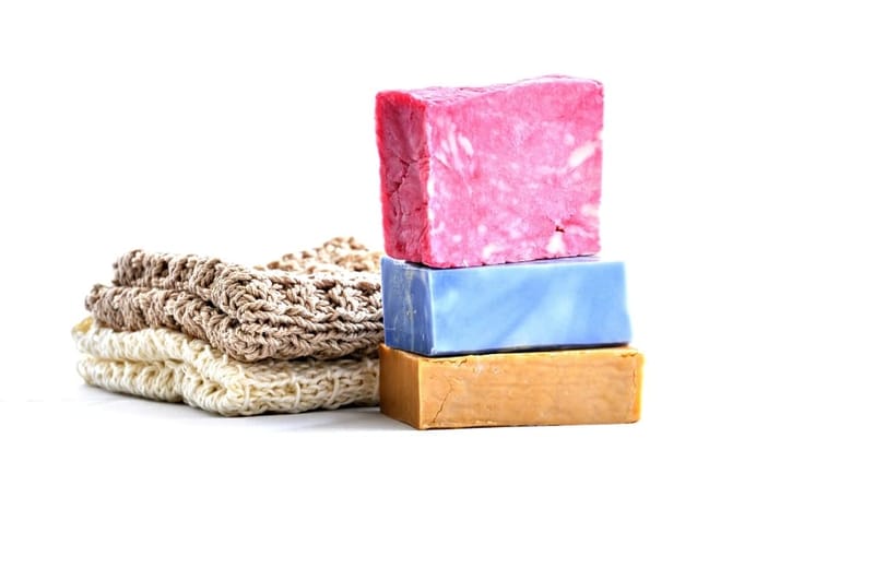 Stacked colourful soaps on white
