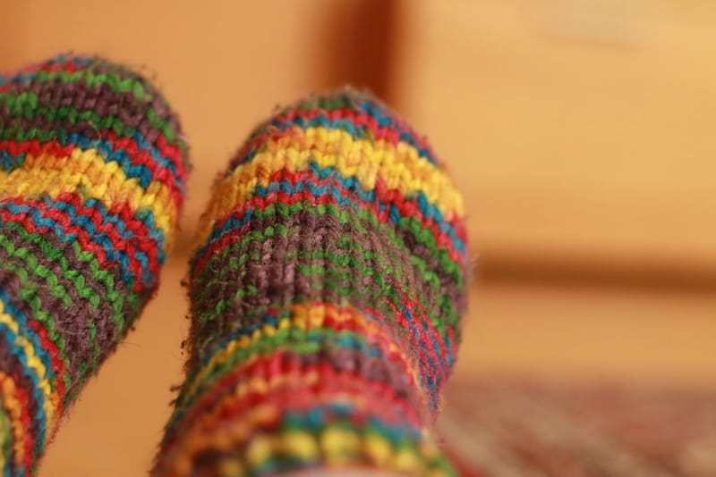 Feet in colourful striped wool socks