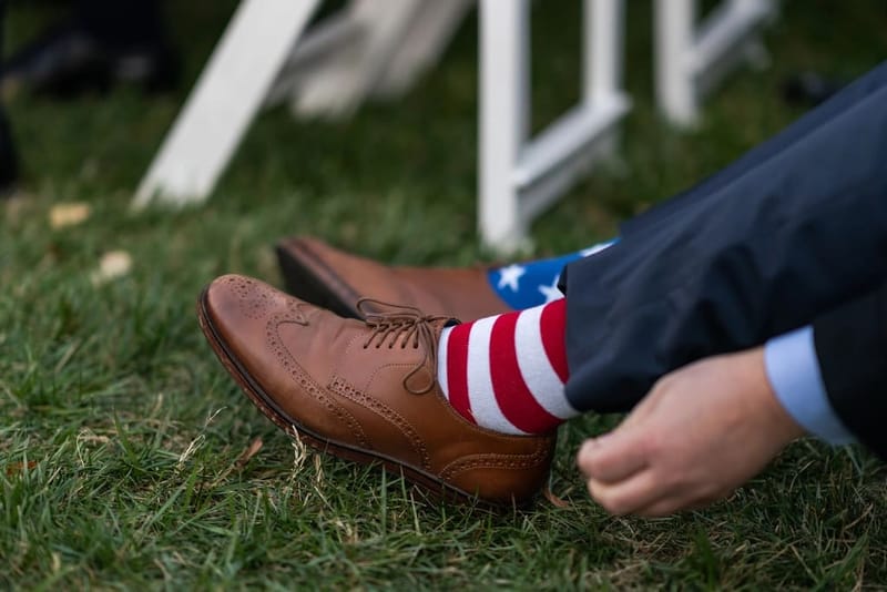 Red and white striped socks with brown leather shoes