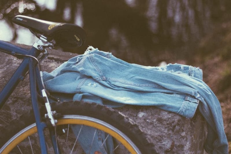 Denim jacket lying on a bicycle rack