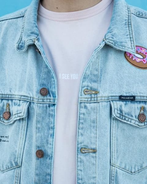 Light blue denim jacket over a white tee, front view