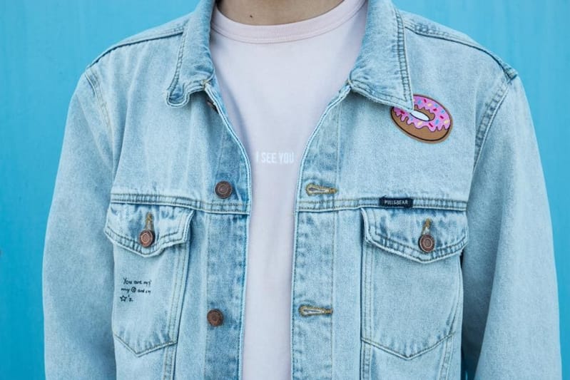 Light blue denim jacket over a white tee, front view